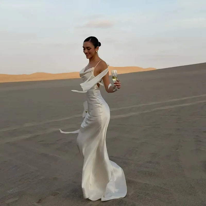 Kishai | Women’s Satin Swing Collar Maxi Dress with Flower Accent and Backless Design