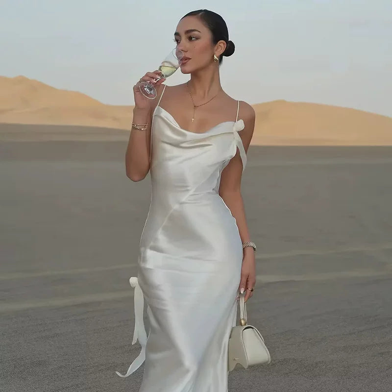 Kishai | Women’s Satin Swing Collar Maxi Dress with Flower Accent and Backless Design