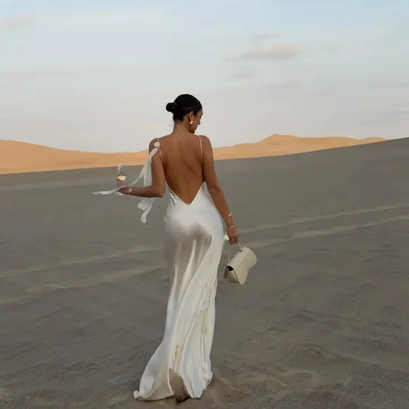 Kishai | Women’s Satin Swing Collar Maxi Dress with Flower Accent and Backless Design